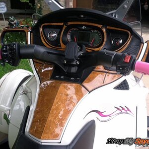 A beautiful combination of our Honey Burl dash kit along with Barbwire 101 graphics kit in Pink.  814-838-6377