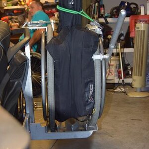 This is looking toward the back of the Spyder. I stuff my RoHo cushion between the wheels. The bungy is used just to clamp the backrest tighter togeth