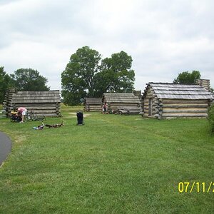 Replicas of cabins built to shelter soldiers.  VF, PA