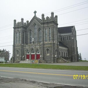 Saint Bernard church. Constructed between 1910-1942 by local resident; made of granite blocks. Seats 1000 people. On the Acadian Shores Drive in Nova 