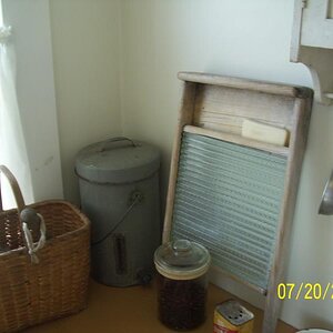 Washboard, cream separator and utensils.