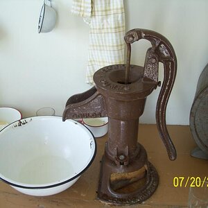 Working hand pump, no running water in the houses and they still burn wood in the stove and bake and cook and clean here.