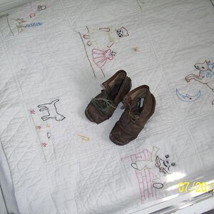 Very old childs leather boots.