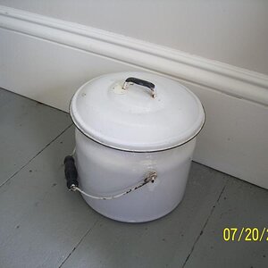 One child visiting is said to have called this a cookie jar; it's another chamber pot. Can you imagine having to empty this each morning? Maybe we wer