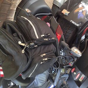 Rivco expandable weather resistant sissybar bag w/cable &luggage locks will fit fair amount of stuff, fyi. Found @ spyderfest'15 rivco is only offerin