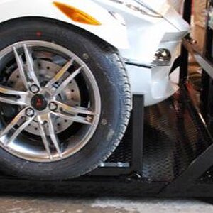 Pictured here, the vertical bar in front of the front wheel prevents the Spyder nose from touching the bulkhead.