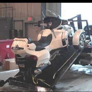 This is a Spyder being loaded onto a full-size truck.