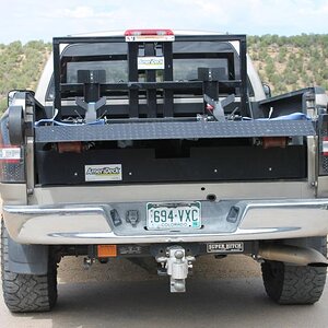 Deck lifted to position in truck.  The deck is above the truck wheelwells allowing tool and equipment storage below deck.  The deck pictured is the st