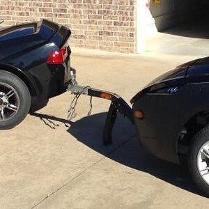 Toung stand & profile view against the new freedom trailer.
Joe had the 622 sides sprayed with LineX for rock protection.  Lot better than repairs.