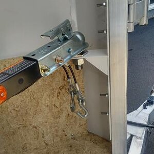 Freedom trailer hitched inside of enclosed trailer