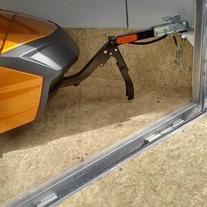 Freedom trailer hitched inside of enclosed trailer