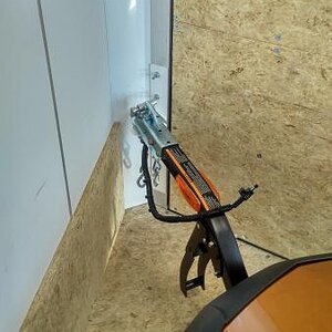 Freedom trailer hitched inside of enclosed trailer