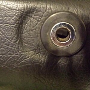 Use 1/2" spacer in factory grommet on front of bag to attach bracket and bag to the front grab bar mount.