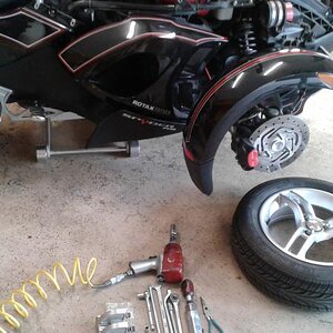 2.  Remove wheels to make it easier to align the shocks back into the re-locater mounts