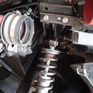 3.  Remove the upper shock bolt...note removing the rectifier will make it possible to remove the bolts and re-install in the new position.