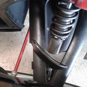 Trimmed the A arm cover to allow full clearance for the shock. You will have to trim both sides and the upper panels as well. Will add photos when fin