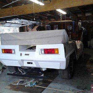 The cloth above the rear shows what the height of the orig car looked like ....the body is actually wher it's going to remain ...