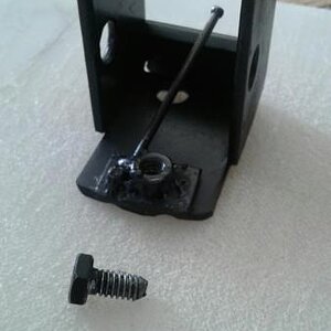 A pic of what the locking plate looks like before it's put into the frame and the bolt used to lock it in place.