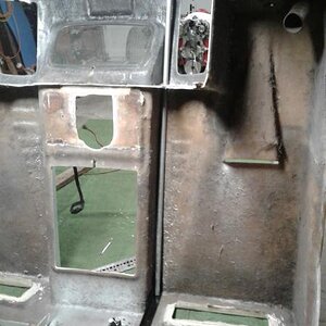 You can see the bracket at the bottom, the upright is 3/4 in. galvanized pipe , bent to fit the inside curve of the body .... some 20ga sheet metal wi