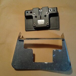 At the top this is the back of the radio connecting device - all the wires go in this ..... The bottom pic is the frame / holder , that the upper piec