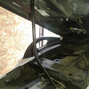 This where my seat rises to for gas access or whatever … I drilled a small hole in the pan bottom so the strut stays in place …. I made the rod from o