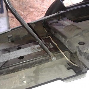 This shows the 5 in. x 1/4 in bolt that goes through the main frame … the holes were there already ( no drilling ) and had push pins in them …. how co