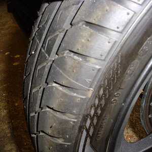 Both OEM front tires have pretty bad  ridges where the mold halves came together when building the tires.
