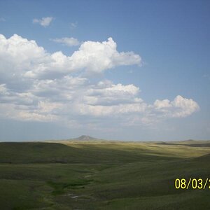 One side of the road.