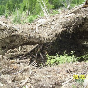 An ice flow where the ground eroded with the water flow.