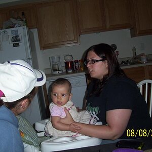 Granddaughter Elysia held by mommy Amy and talking to Aunt Suzanne at Ft Lewis, WA