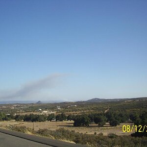 Hills around home; fire in Mexico across the border.