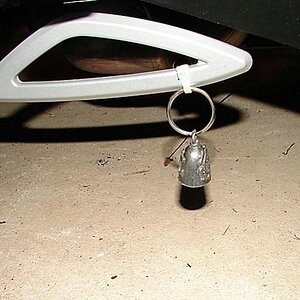 Keep it as low to the ground as possible on your bike so the ringing of the bell keeps the "Road Gremlins" from hanging on and harming your bike!  Whe