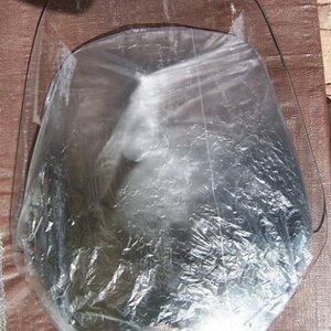 RoboBrackets 20" windshield. My BRP Sport Touring shield is wrapped in plastic under the new shield so you can note the difference in size.