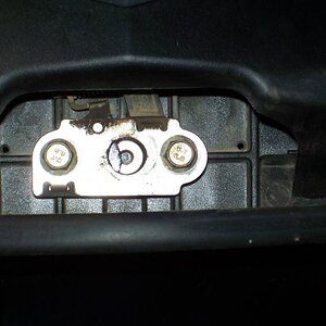 The washer stops the spring from being caught by the catch.