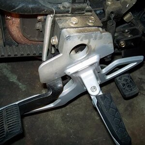 Foot brake. Left side showing return spring