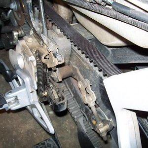 Foot brake. Left side showing linkage from behind.