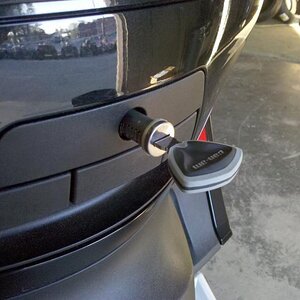 The lock hanging out of the back.  It should be in, slight beyond flush.