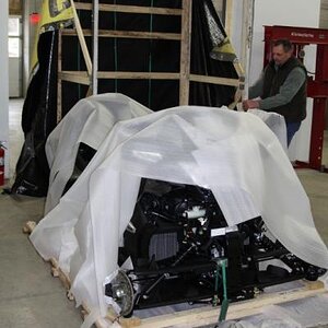 The crate has just been tilted off of it's base, front to rear. It was only connected to base by screws along the bottom.