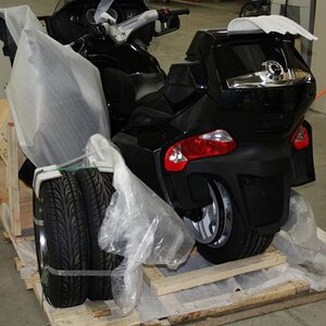 The front tires are together on the left rear.