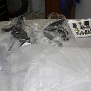 Some of the add on parts that were inside the nose assembly. Notice that all the required nuts, bolts and lug bolts are on a vacuum plastic sheet.