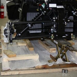 Front end being jacked up to put on wheels. ( a little out of order)