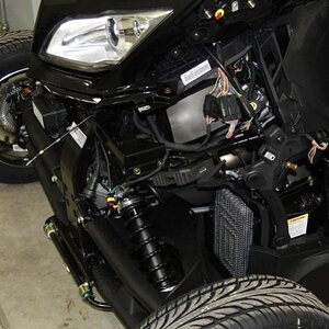 Front side panels, and panel under headlight assembly removed so nose assembly could be attached.