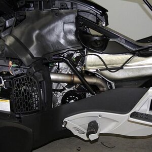 Left side panels removed showing fuel tank exhaust header. The panel giving access to the oil tank, for adding or checking, now is easier to do, do to