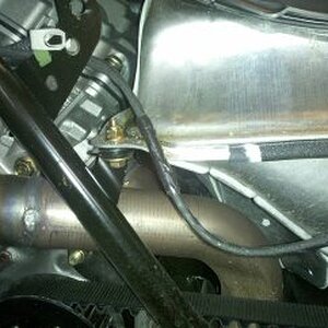 Black duct tape wrapped around wiring harness to provide better protection.