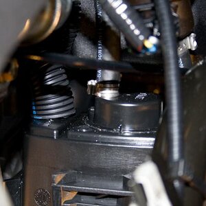 2010 RS SpyderNewEvapCan 2 - Vent hose on the left side of the evap.  canister, closest to the engine. Notice the loom installed over the hose. I did 