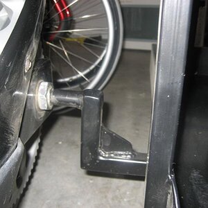 rear mounting arm through axle