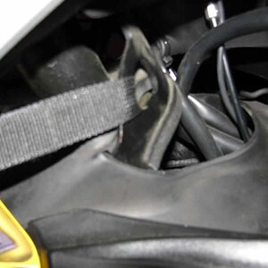 Connect front straps through stock bracket under steering tree