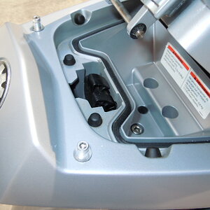 The screws and spacers installed. The bottom cover of the sport rack must be removed to install self locking nuts on the screws. The cover is held on 