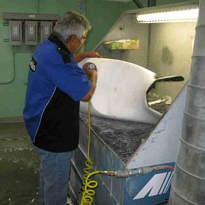 Here Julio is shaping the foam to fit my fat butt.