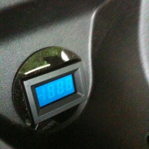 LED voltage meter measuring battery volts and charge current.